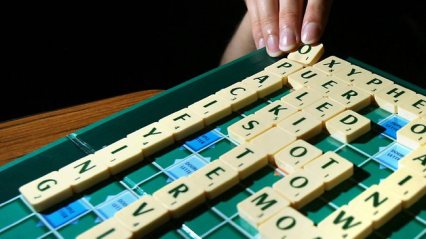 scrabble board and letter tiles